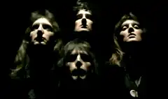 Queen band members singing in harmony