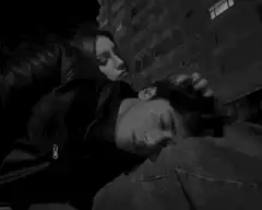 woman stroking sleeping man's hair