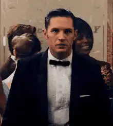 Tom Hardy in a tuxedo looking serious
