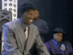 James Brown laughing and shaking hands