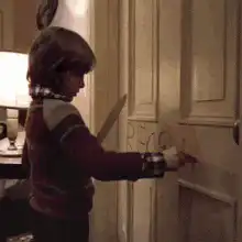 Danny Torrance writes REDRUM on the door