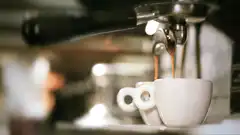 espresso pouring into white cup