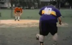 fat man kicks soccer ball and celebrates