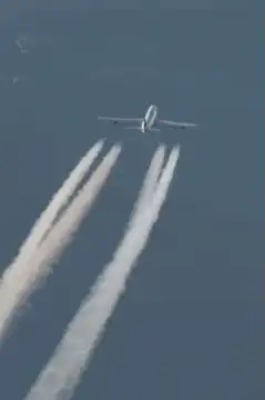 Airplane with four contrails