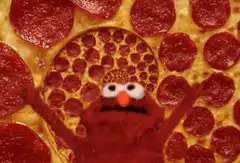 Elmo on a pepperoni pizza