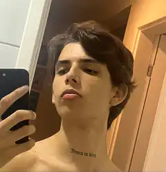 Young man showing neck tattoo