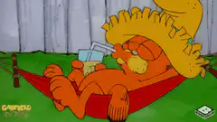 Garfield relaxing in a hammock with a drink