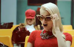 Iris West-Allen adjusting her glasses
