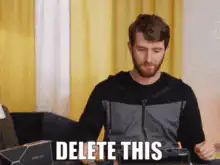 Man holding knife with DELETE THIS text