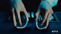 Hands shuffling cards with blue light