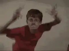 Boy in red shirt dancing with friend