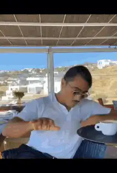 Man drinks coffee with sunglasses
