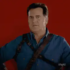 Bruce Campbell thumbs up and points