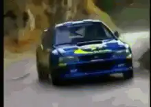 Blue Subaru Impreza WRC rally car drifting