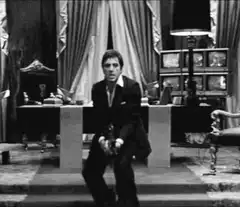 Tony Montana screaming and firing gun