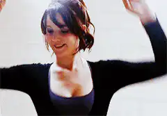 Woman dancing and smiling