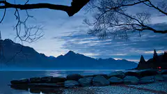 Blue twilight lake and mountains