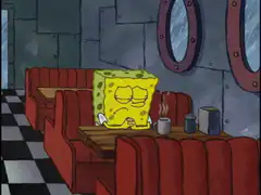 SpongeBob sitting alone at a table