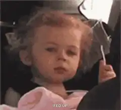 Fed up toddler rolls eyes
