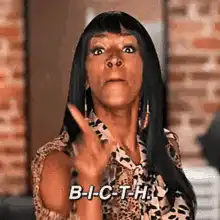 Woman spelling Bitch with finger