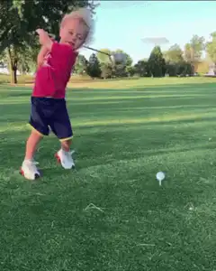 Toddler swings golf club and falls over