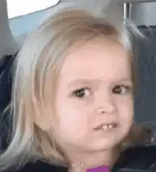 Blonde toddler confused face
