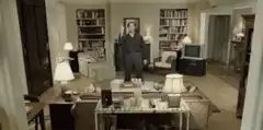 Man standing on table covered in yellow goo