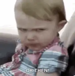 Toddler eating with skeptical face