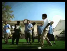 Dancing man in white shirt on lawn