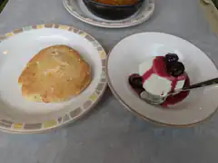 dessert and bread on plates