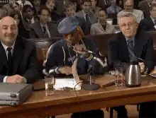 Snoop Dogg holds up F card