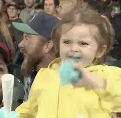 Toddler eats blue cotton candy