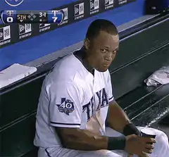 Derek Jeter smirks and smiles in dugout