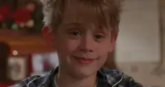 Macaulay Culkin smirking