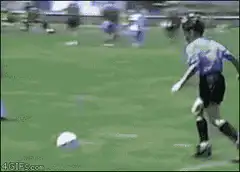 Soccer player kicks ball into own goal