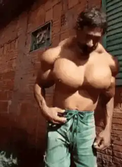 Muscular man flexing chest