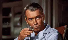 James Stewart raising a glass