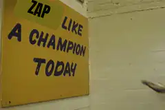 Football player high fives sign