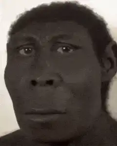 Man looking down then smiling