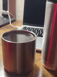 metal cups with red laser light
