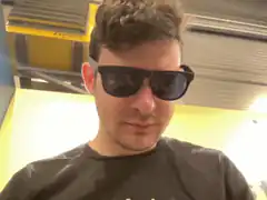 Man in sunglasses looking down