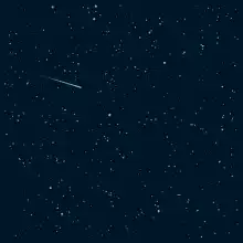 shooting star in night sky