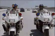 Police officer fist bumps driver