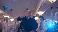 Elderly man dancing at a disco