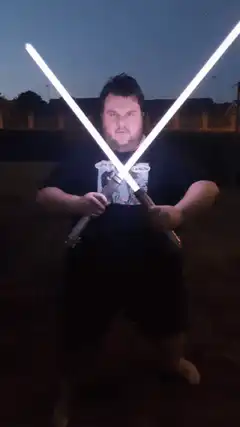 Man with two lightsabers