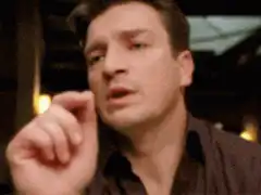 Jeremy Renner pinching his nose