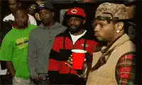 Usher looking around with a red cup