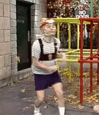 Man in striped shirt dancing on playground