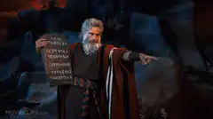 Moses holding stone tablets pointing