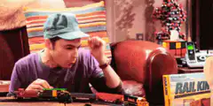 Sheldon playing with toy train